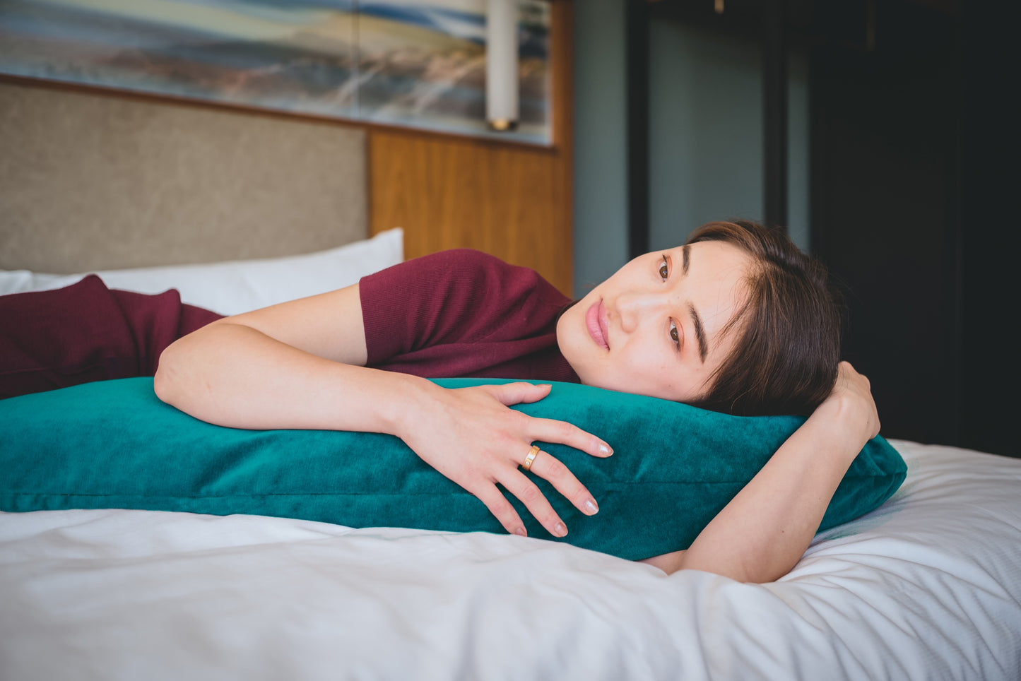 Woman lying comfortably with hiamom body pillow