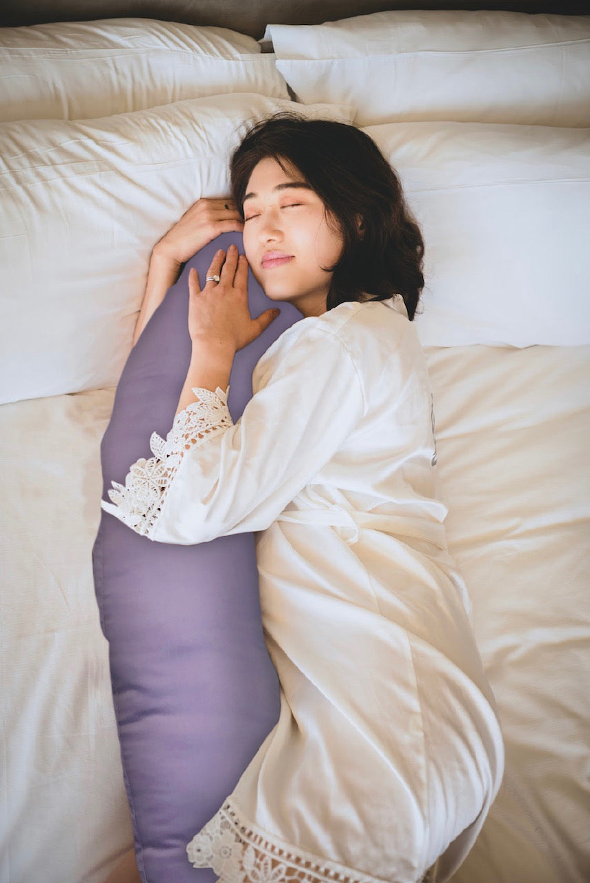 Woman sleeping with hiamom body pillow